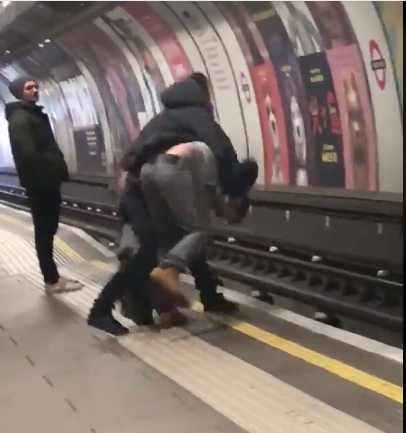 Crazy: Fight On West London Train Tracks Almost Ends In Guy Getting Hit By Train...